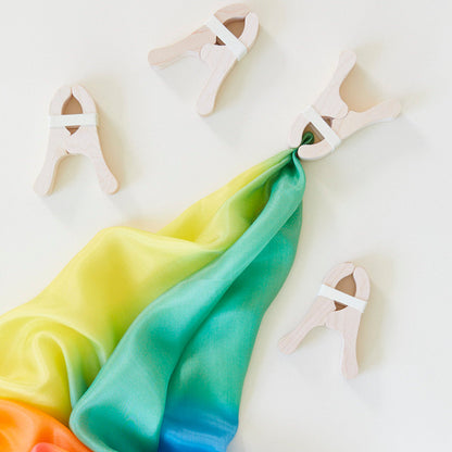photo of colorful canopy cloth with wooden clips