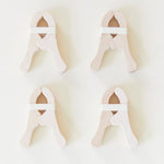 Four Playclips with white bands, arranged in a grid on a light background—perfect open-ended toys for creative play and fort building.